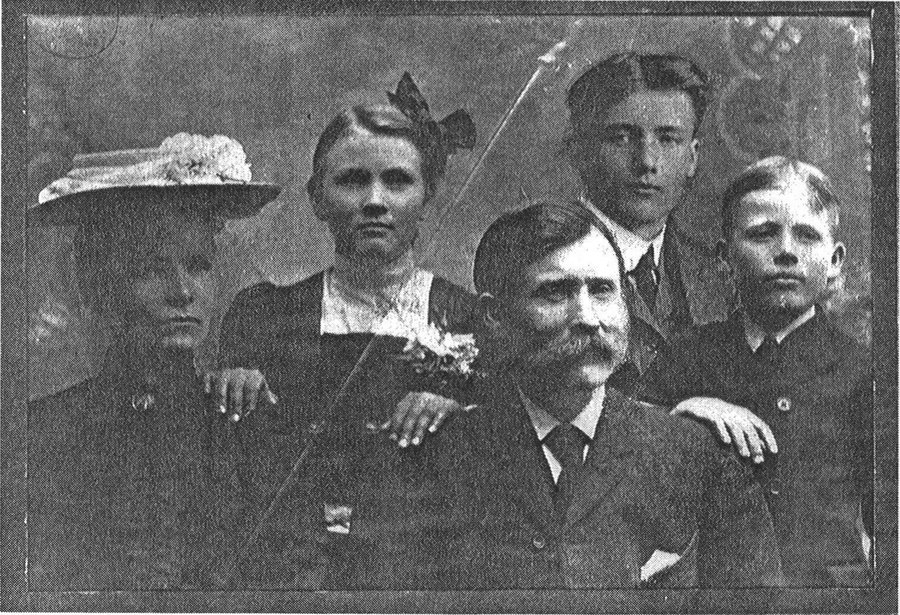 Charlie Olson (pictured as a boy, back row right) with mother Anna Frestrom, father John Olson, sister Hilda, and brother Augustus "Gus" Olson, as printed in Monograph #07